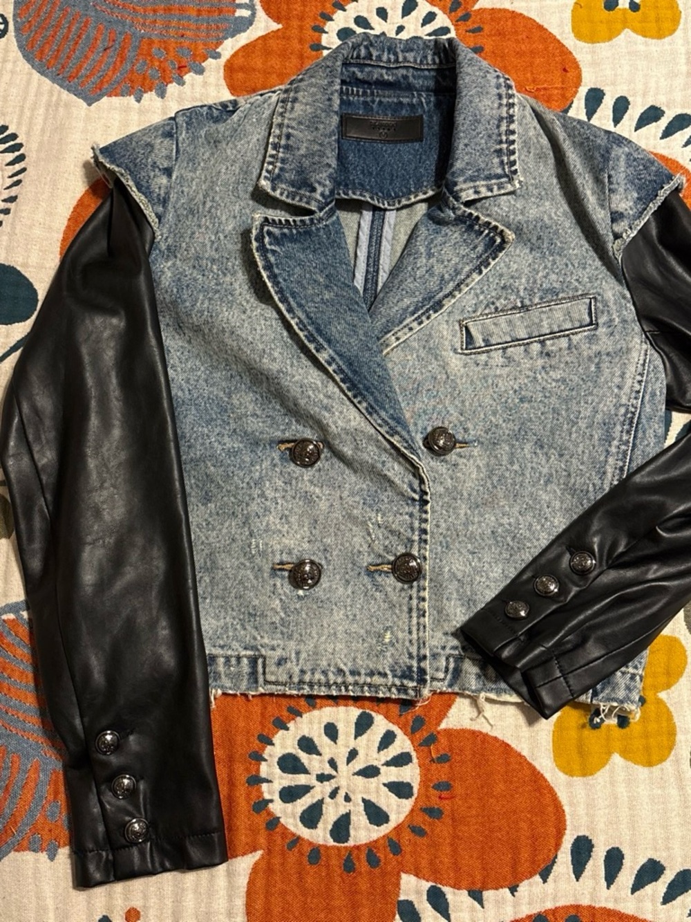 BlankNYC Short waist Denim jacket with black vegan leather sleeves